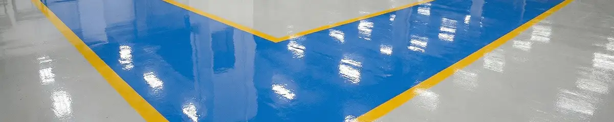 A factory floor professionally covered and marked with epoxy flooring in Aurora, IL