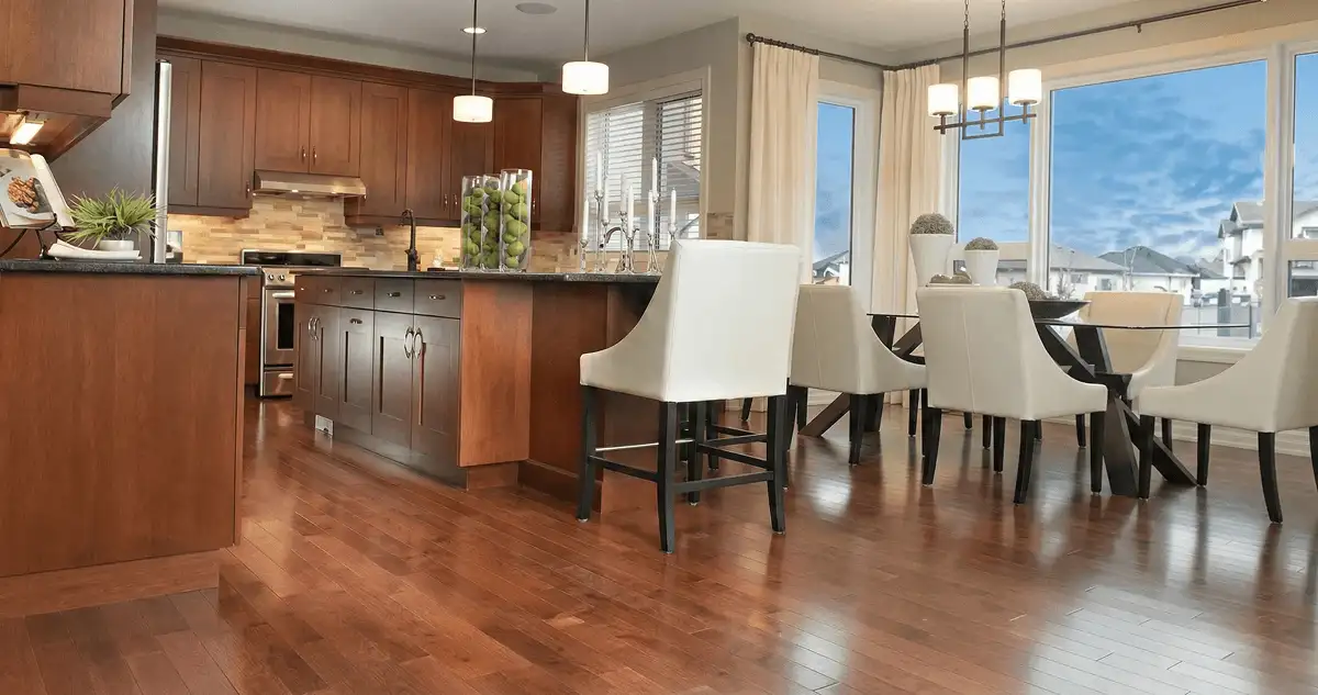 A modern kitchen with professionally installed wood flooring in Aurora, IL
