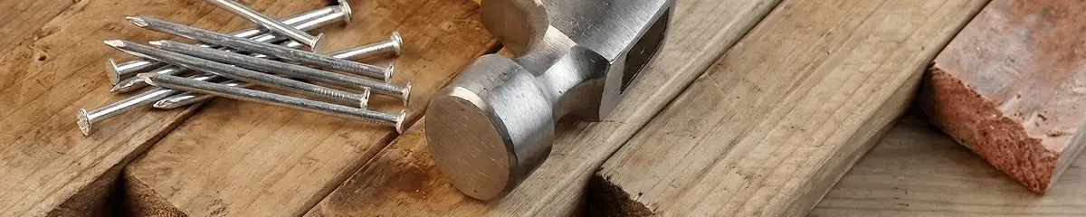 Hammer and nails on hardwood flooring boards in Aurora, IL