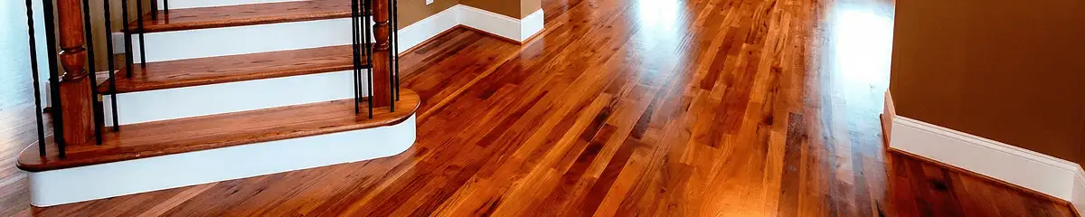 Base floor of a staircase with professionally restored wood flooring in Aurora IL