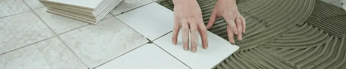 Professional installing white tile floors in Aurora, IL