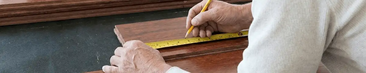A professional installing wood flooring in Aurora, IL